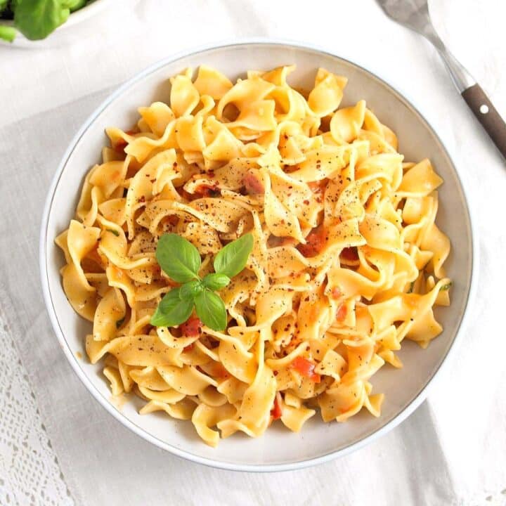 pasta in coconut milk in a large bowl