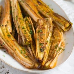 leeks side dish sprinkled with parsley.