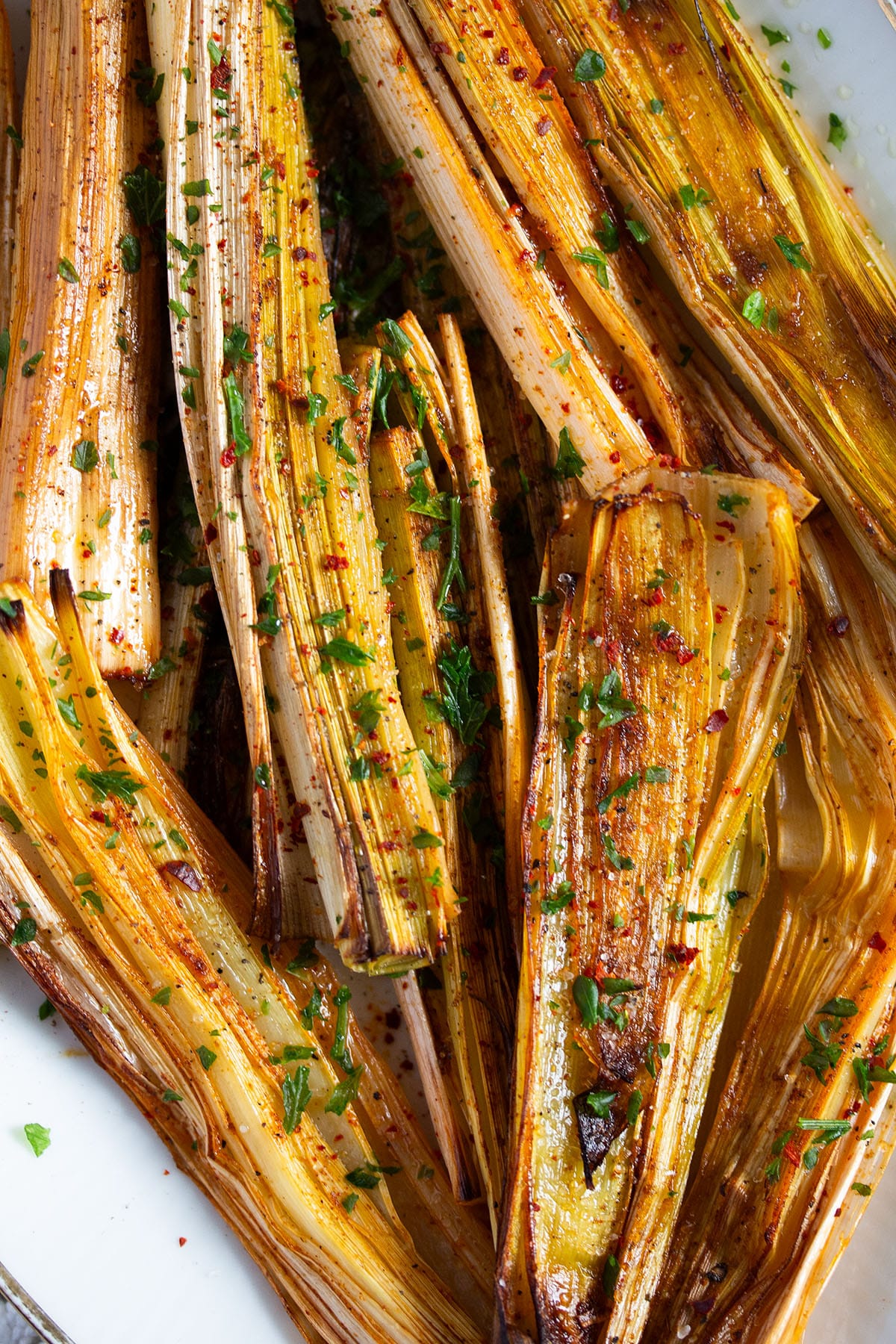 leeks roasted in the oven and sprinkled with parsley.