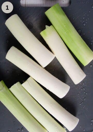 pieces of leek on a cutting board.