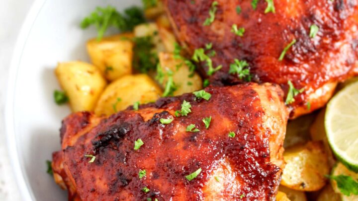 chicken glazed with barbecue sauce served with potatoes