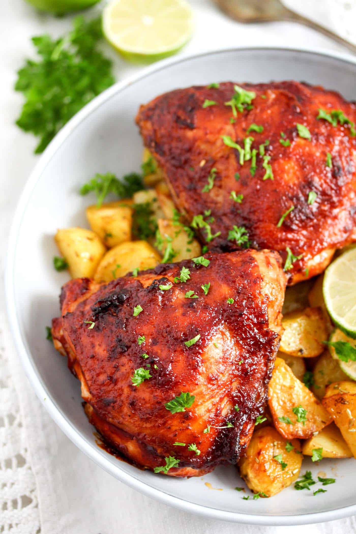 chicken glazed with barbecue sauce served with potatoes