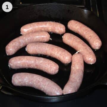 raw brats in a cast iron skillet.