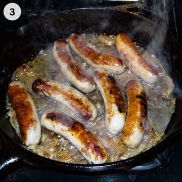 cooking brats in beer in a skillet on the stove top.