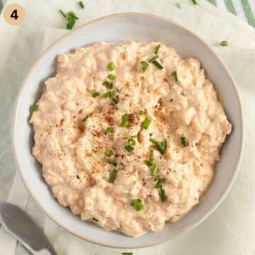 camembert cheese dip with onions in a bowl.