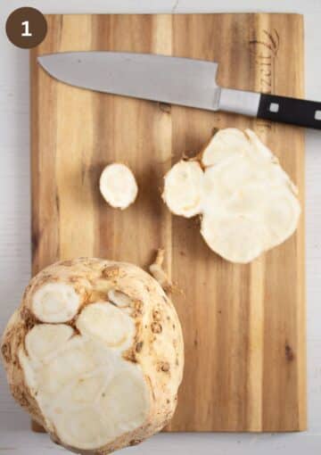 topping a celeriac head with a large knife.