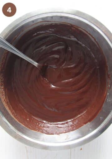 mixing chocolate mixture to make truffles with a spoon.