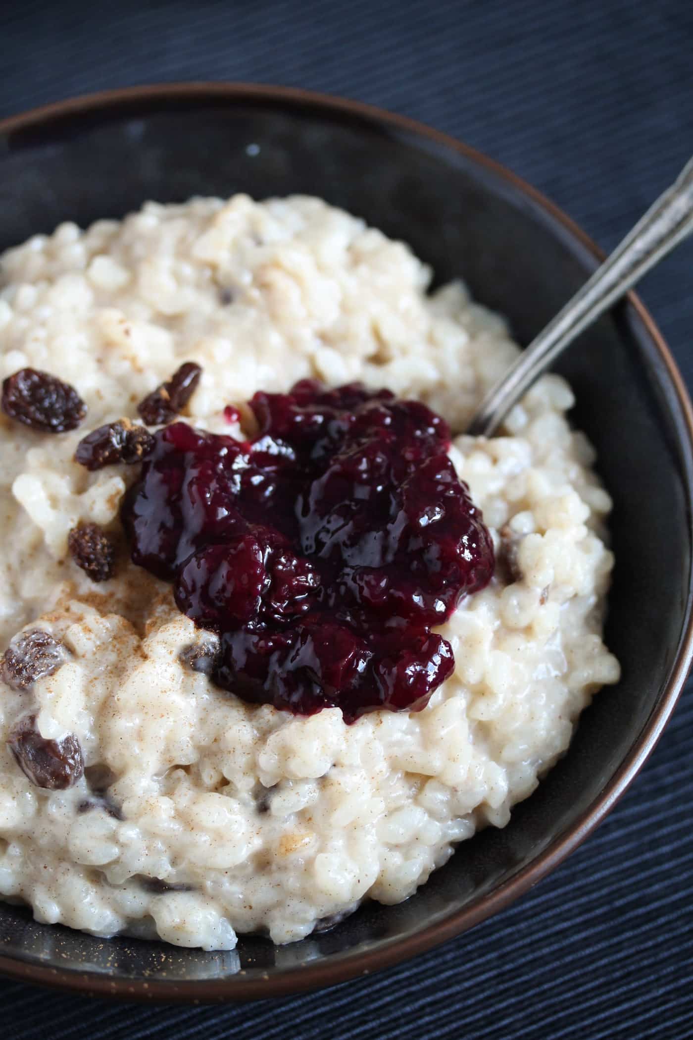 condensed milk rice with raisins and blueberry sauce