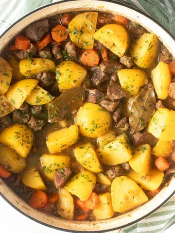 lamb and potato stew in a large dutch oven.
