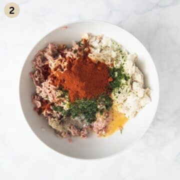 all ingredients for making german meatballs in a bowl before mixing.