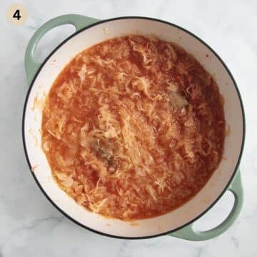 sauerkraut mixed with tomato paste, water and seasoning in pot before cooking.