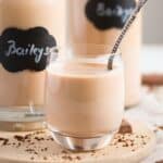 a small glass with thermomix bailey's with a spoon inside.