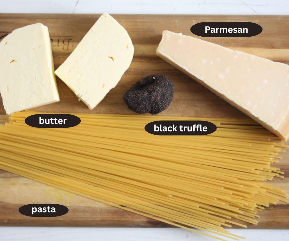 labeled ingredients for cooking black truffle with butter, parmesan and spaghetti.