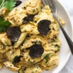 eggs with shaved black truffles slices on top.