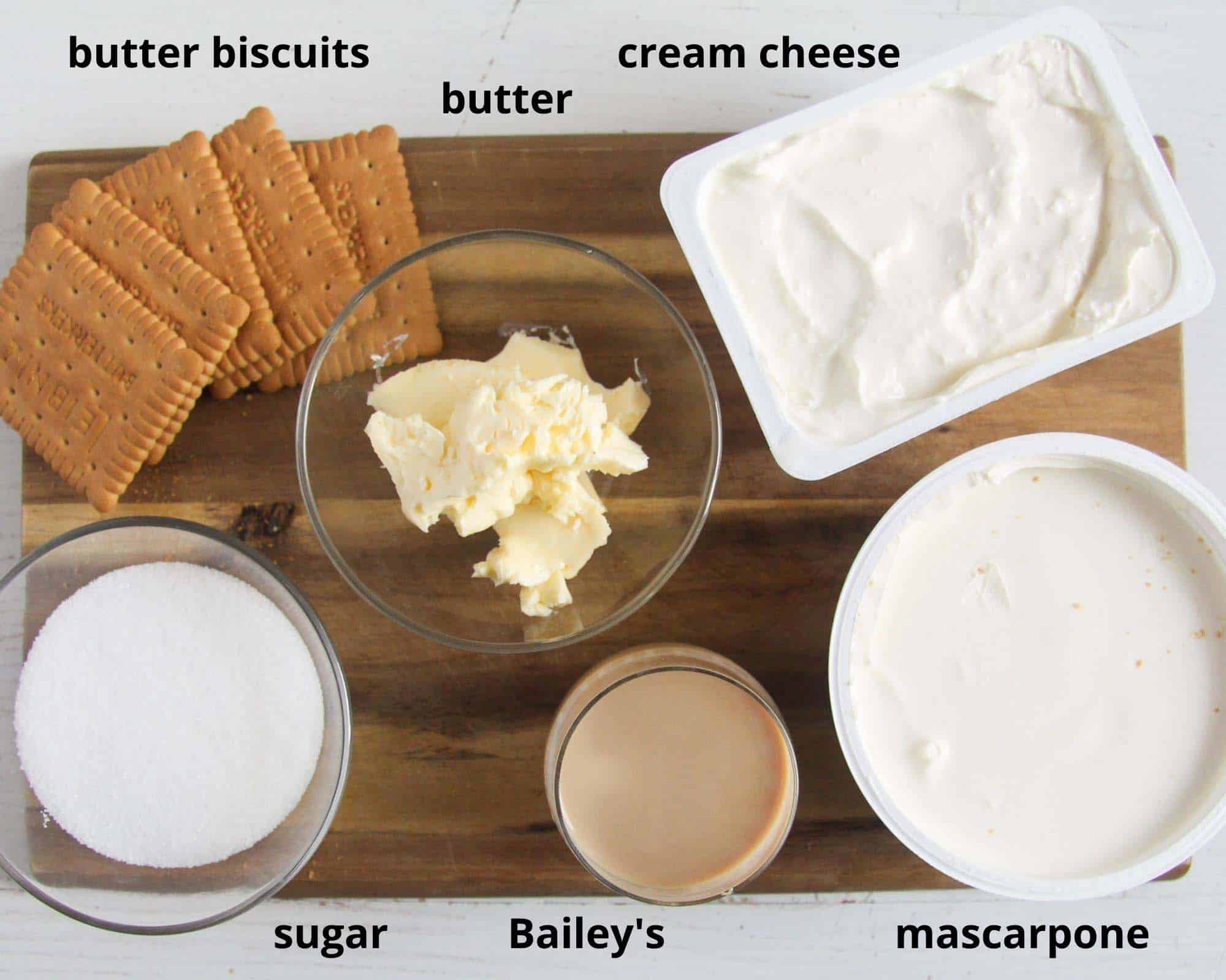 biscuits, cream cheese, mascarpone, sugar, butter, baileys on a wooden board.