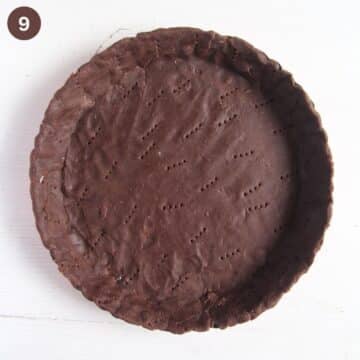 baked chocolate tart shell in a pie form.