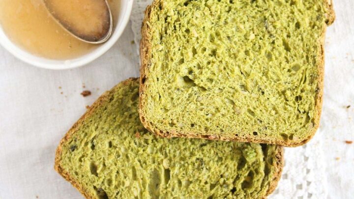 green spinach bread slices and a small bowl of jam.