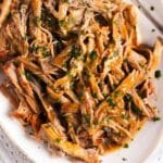 pinterest image with the title dutch oven pork butt.