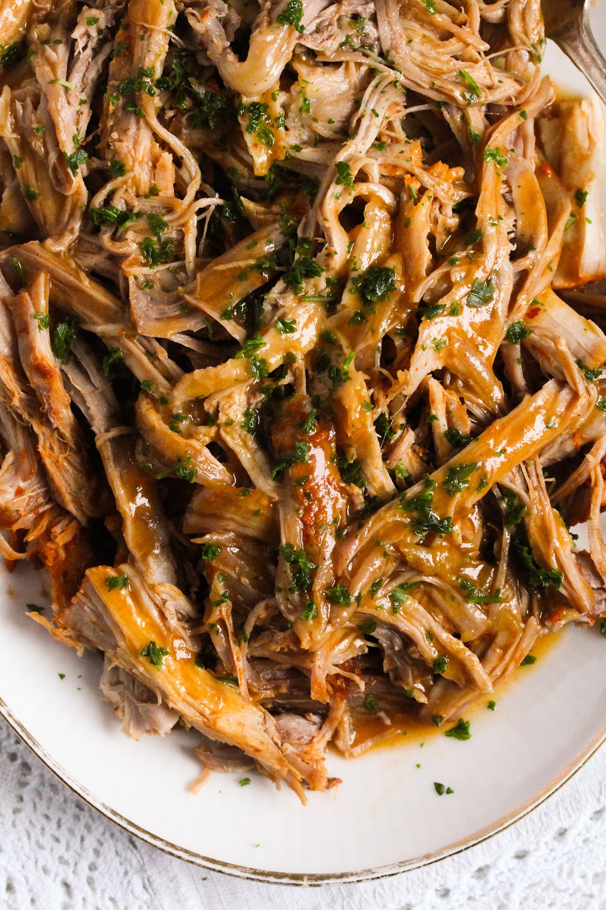 pork butt shredded on a plate.