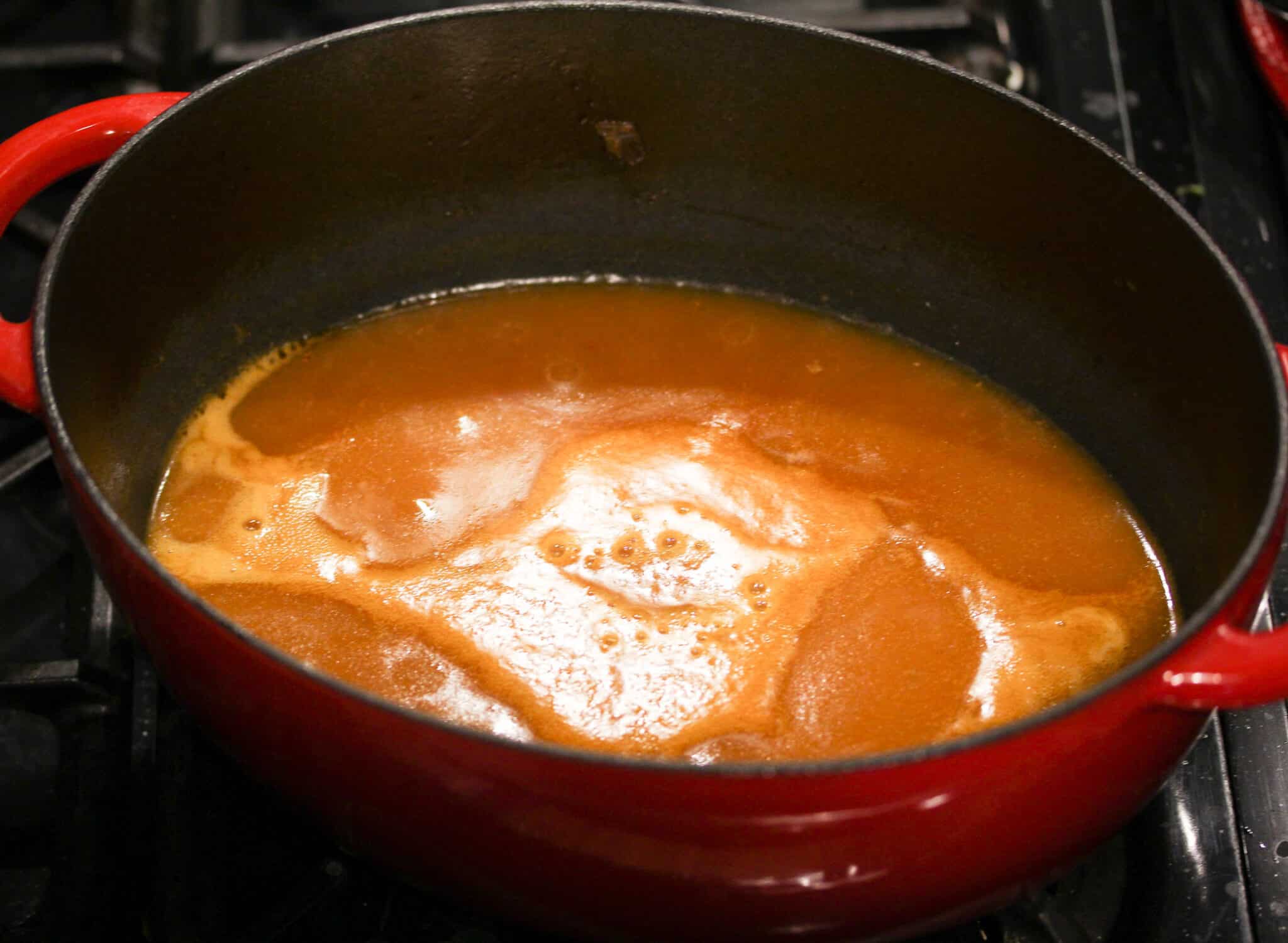 close up of a pot with sauce.