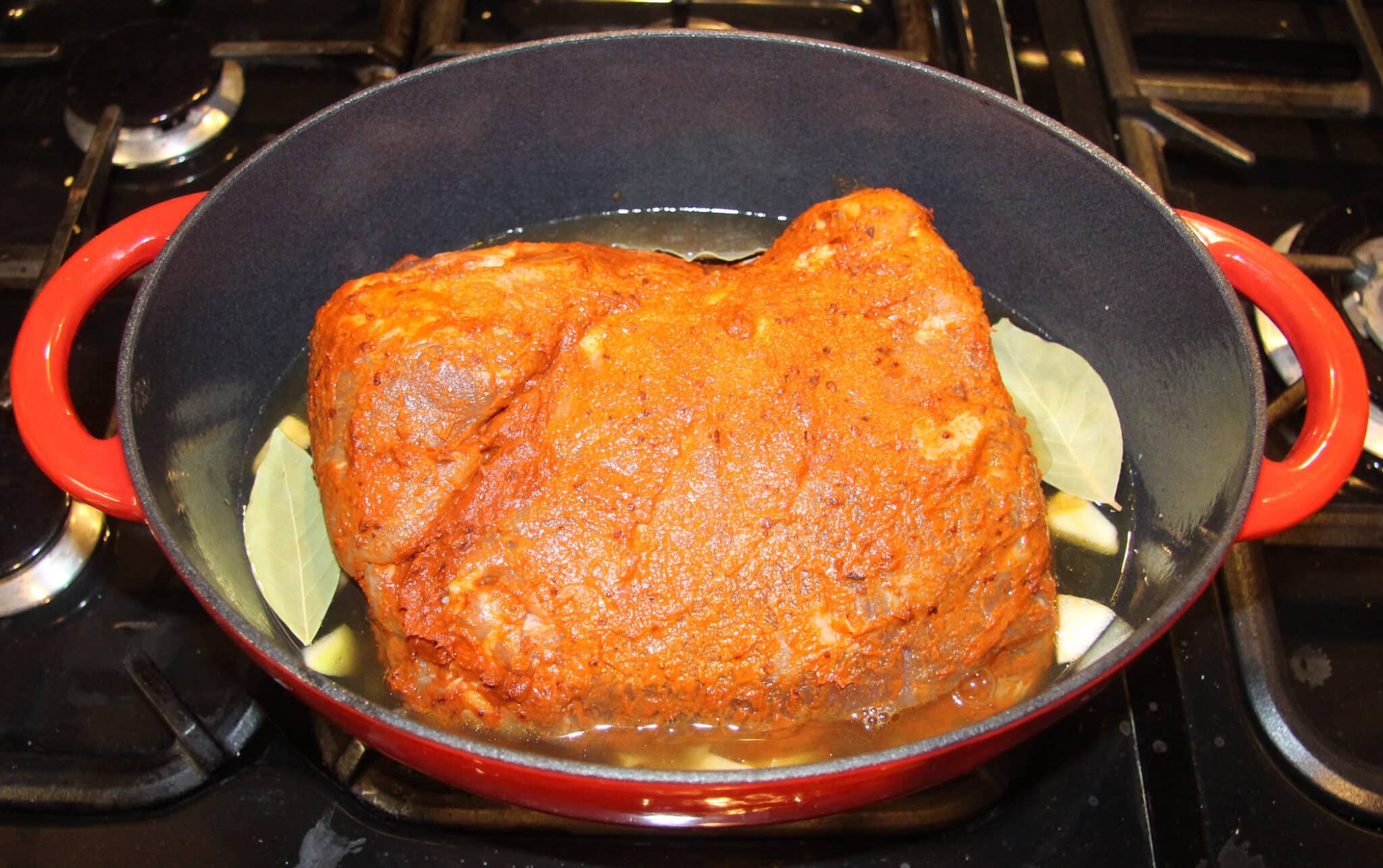 rubbed piece of meat in a dutch oven before cooking.