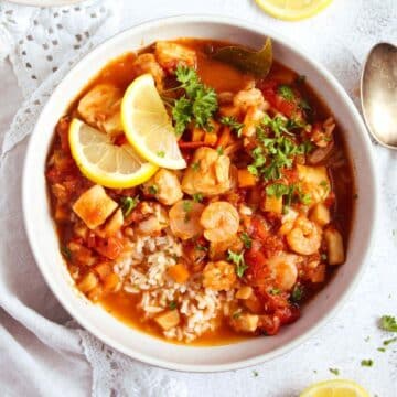 stewed fish with tomatoes served over rice.