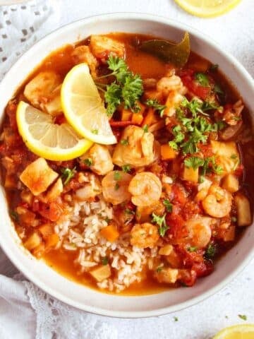 stewed fish with tomatoes served over rice.