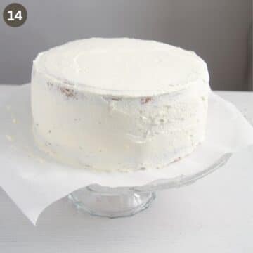 cake covered in whipped cream before adding the decoration.