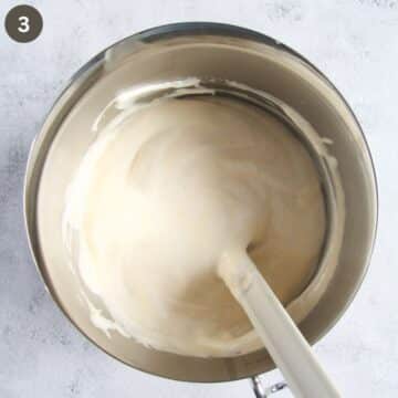 folding egg whites with a spatula in cake batter.