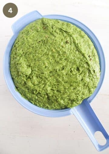 risen green dough for bread in a bowl.