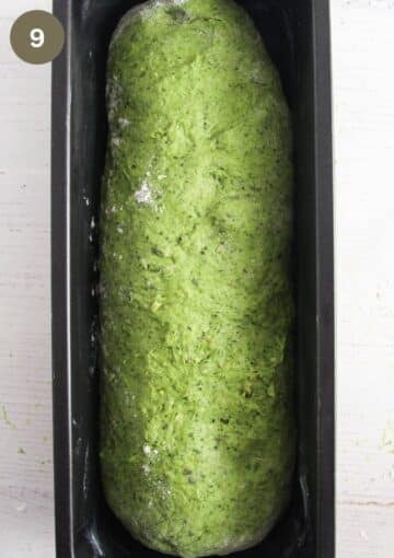 a loaf of green bread dough in a loaf pan before baking.