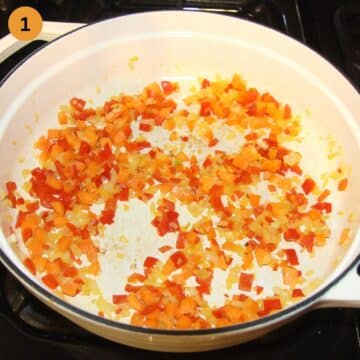 sauteing diced vegetables in a pot to make lamb ragu.