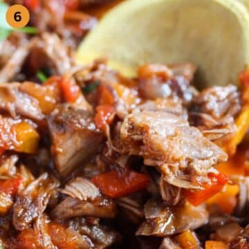 juicy pieces of lamb meat and carrots stirred with a wooden spoon.