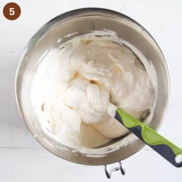 folding whipped cream into cheesecake filling with mascarpone.