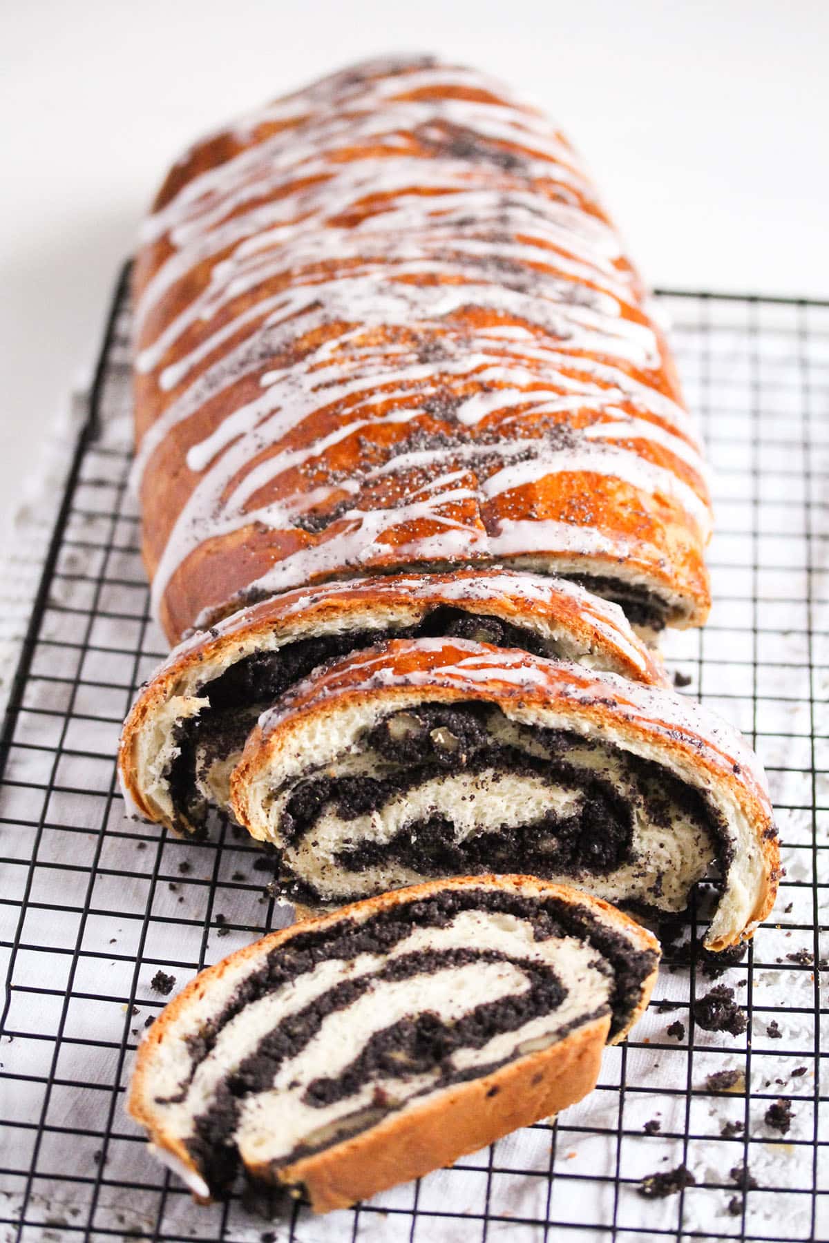 polish poppy seed cake sliced on a wire rack.