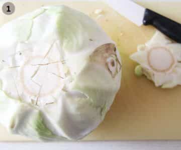 removing the core from a head of cabbage with a knife.