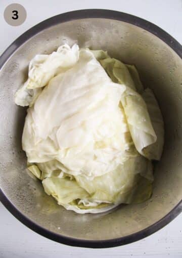 pre-cooked cabbage leaves for making cabbage rolls in a bowl.