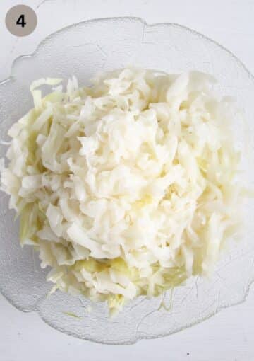 finely chopped pre-cooked white cabbage in a bowl.