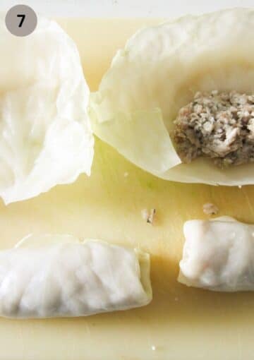 filling and rolling cabbage leaves to make romanian sarmale.