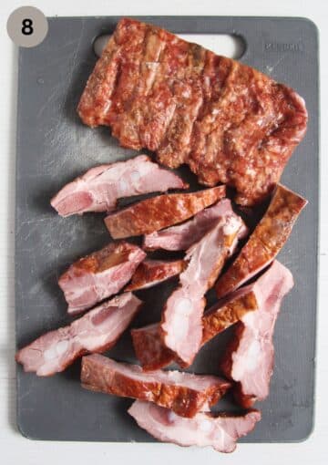 one piece of smoked pork ribs partially cut into smaller pieces.