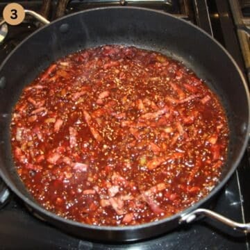 deglazing a pan containing bacon and bacon with red wine.