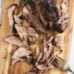 slow cooker lamb shoulder pulled with a fork.