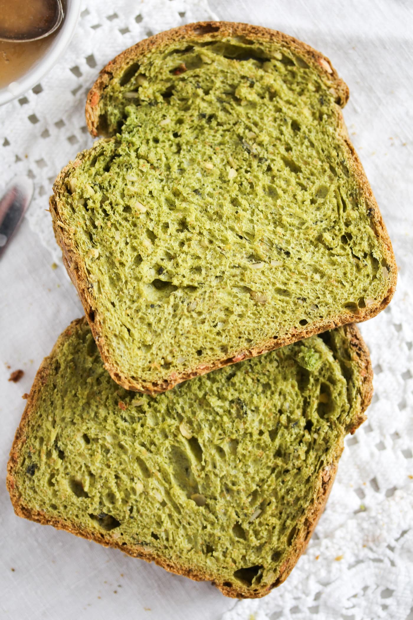 close up two slices of green bread.