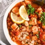 pinterest image with the title stewed fish.