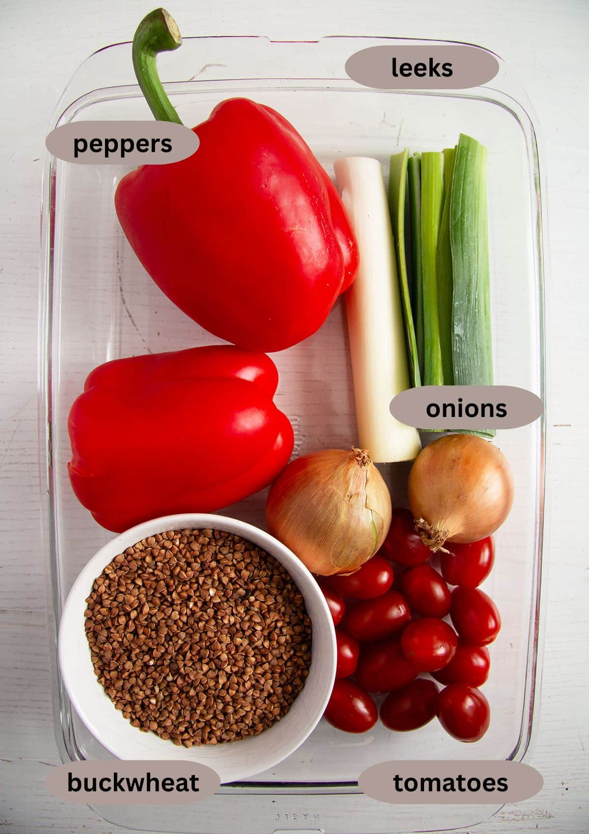 peppers, leeks, onjons, cherry tomatoes, buckwheat for making kasha on the table.