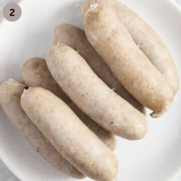 parboiled sausages on a plate.
