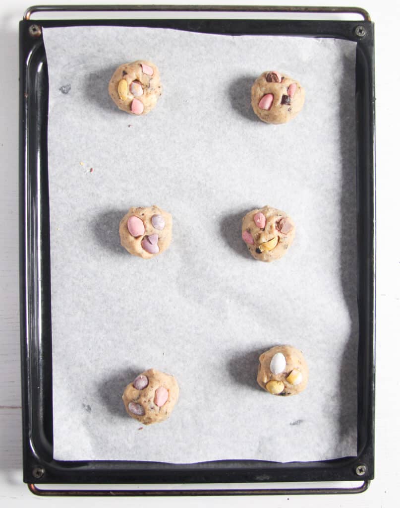 dough balls on a baking tray before baking.