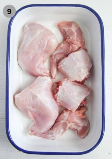 cut up pieces of rabbit in a tin.