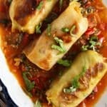 pin image with the title vegetarian stuffed cabbage rolls.