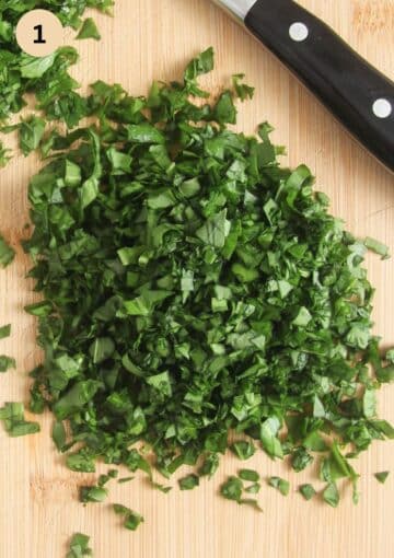 finely chopped wild garlic butter on a cutting board.